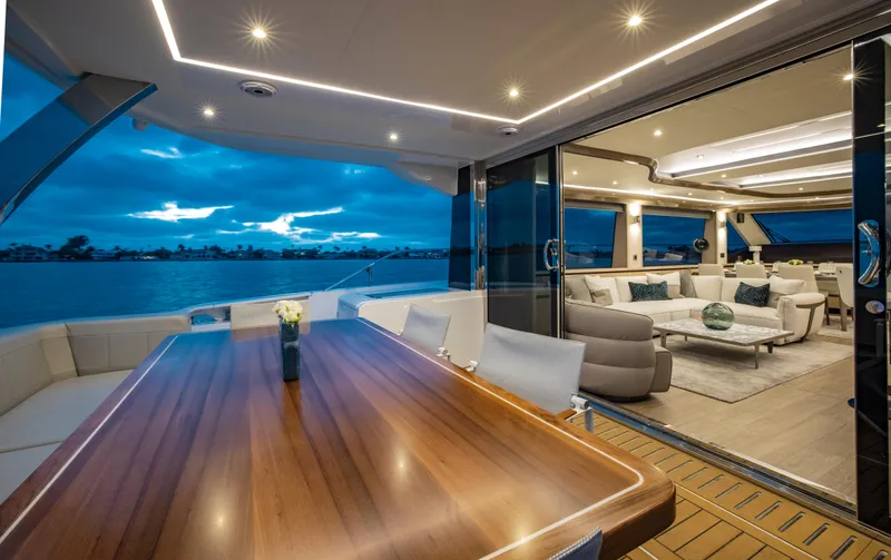 Aquila 70 Yacht Photos Pics Luxurious interior of 2026 Aquila 70 yacht with elegant dining and lounge areas.