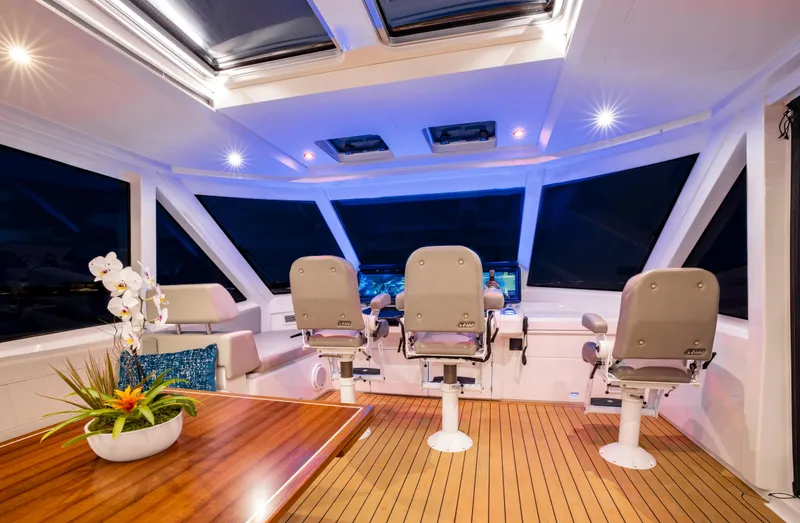 Aquila 70 Yacht Photos Pics Luxurious interior of 2026 Aquila 70 yacht with modern seating and elegant decor.