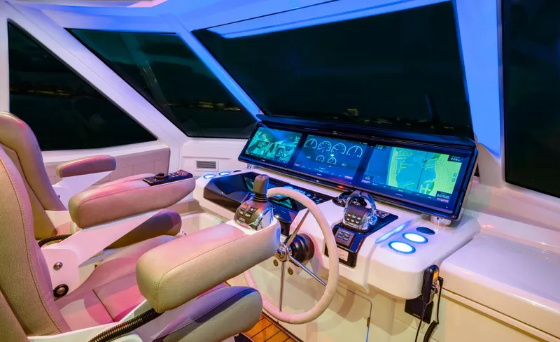 Aquila 70 Yacht Photos Pics Cockpit of 2026 Aquila 70 Luxury yacht with advanced navigation systems and plush seating.