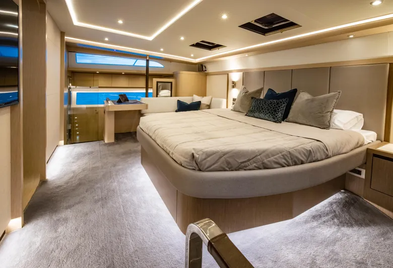 Aquila 70 Yacht Photos Pics Luxurious bedroom interior of 2026 Aquila 70 Luxury yacht with modern design and ambient lighting.