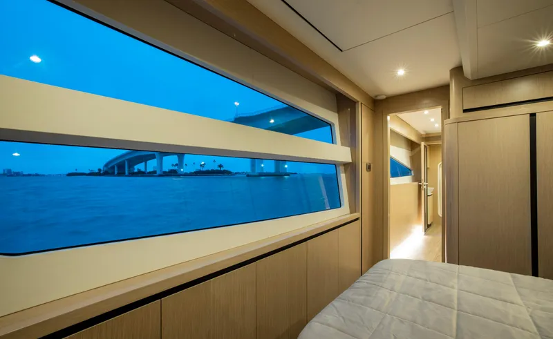 Aquila 70 Yacht Photos Pics Luxurious cabin interior of 2026 Aquila 70 Luxury yacht with panoramic window view.