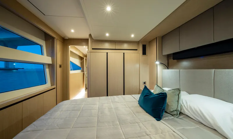 Aquila 70 Yacht Photos Pics Luxurious bedroom interior of 2026 Aquila 70 Luxury yacht with modern design and ambient lighting.