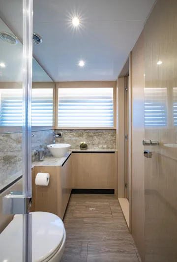 Aquila 70 Yacht Photos Pics Luxurious bathroom in 2026 Aquila 70 Luxury yacht with modern fixtures and elegant design.