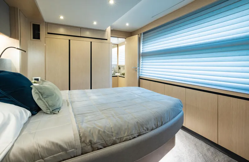 Aquila 70 Yacht Photos Pics Luxurious bedroom interior of 2026 Aquila 70 Luxury yacht with modern design and elegant furnishings.