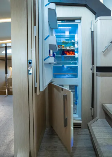 Aquila 70 Yacht Photos Pics Modern kitchen in 2026 Aquila 70 Luxury yacht with open fridge.