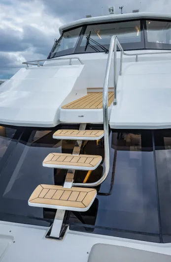 Aquila 70 Yacht Photos Pics 2026 Aquila 70 Luxury yacht with sleek exterior stairs and modern design.