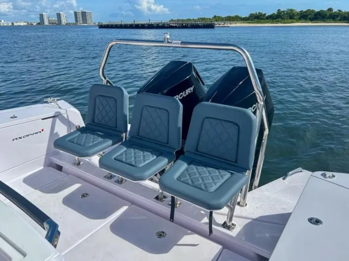  Yacht Photos Pics 2024 Axopar 37XC CROSS CABIN boat with triple seats and dual Mercury engines on water.