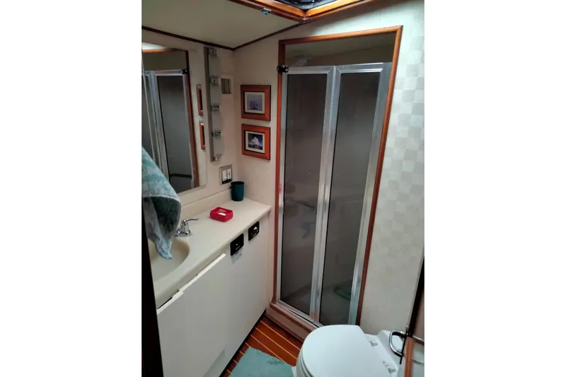 Always Right Yacht Photos Pics Bathroom interior of 1988 Viking 48 Convertible yacht with shower and sink.