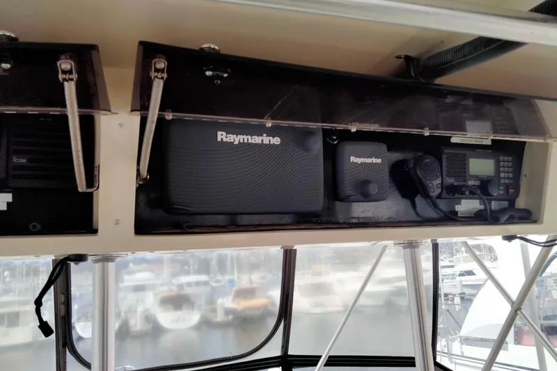 Always Right Yacht Photos Pics 1988 Viking 48 Convertible boat dashboard with Raymarine navigation equipment.