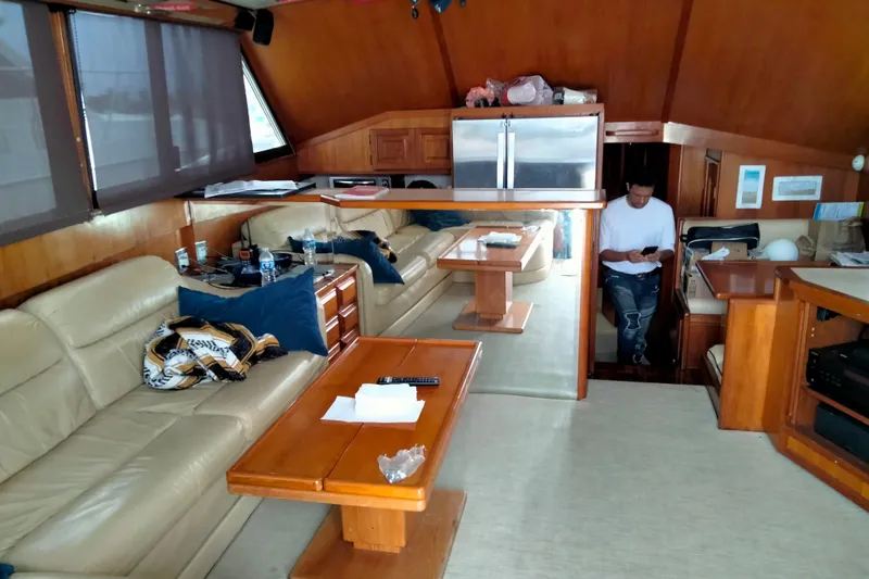 Always Right Yacht Photos Pics Luxurious interior of 1988 Viking 48 Convertible yacht with leather seating and wooden furnishings.