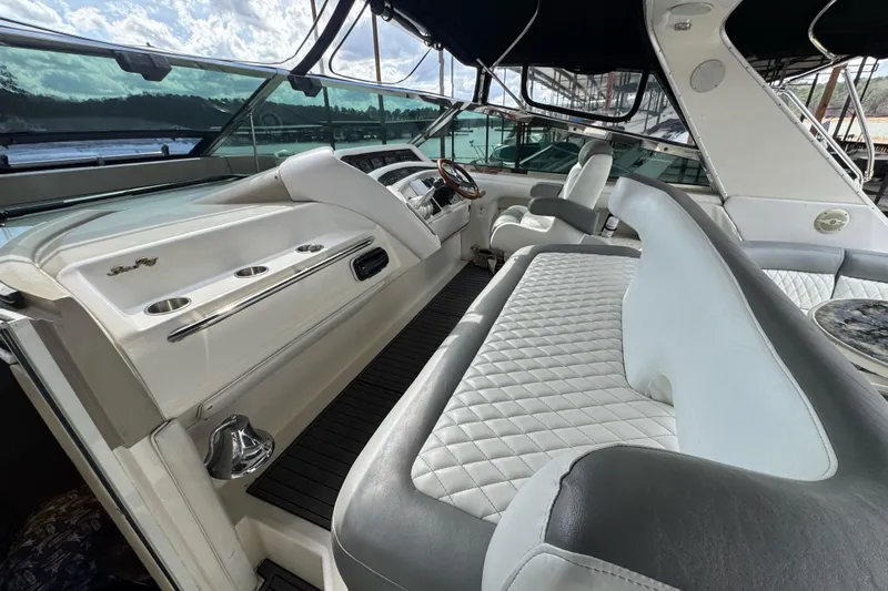  Yacht Photos Pics 1996 Sea Ray 500 Sedan Bridge interior with luxurious seating and helm.