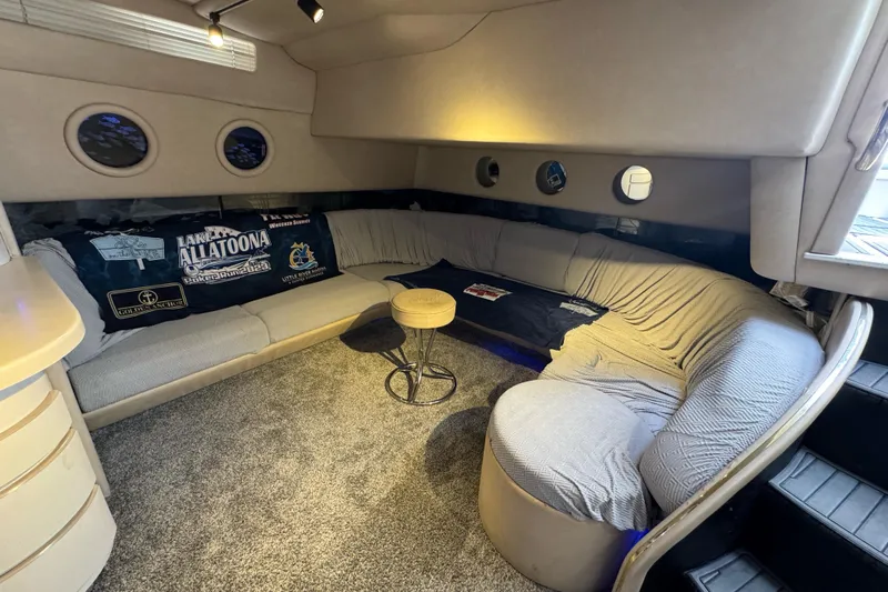  Yacht Photos Pics Luxurious 1996 Sea Ray 500 Sedan Bridge interior with cozy seating and nautical decor.