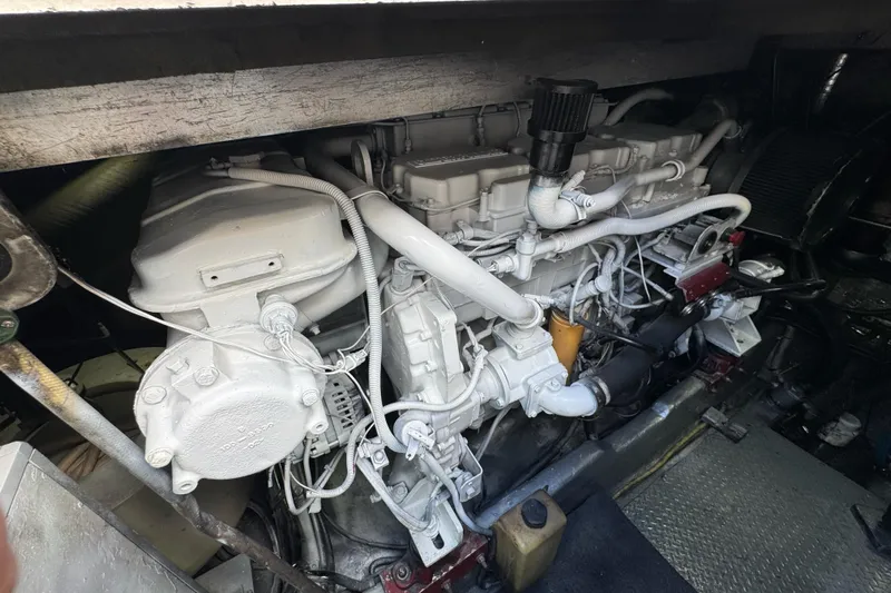  Yacht Photos Pics Engine compartment of a 1996 Sea Ray 500 Sedan Bridge, showcasing detailed mechanical components.