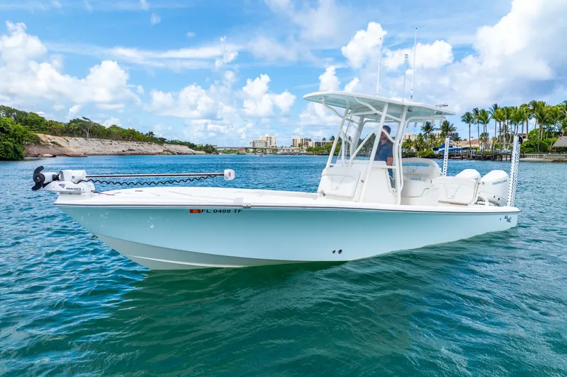  Yacht Photos Pics 2022 SeaVee 270Z boat cruising on a sunny day with clear blue skies.