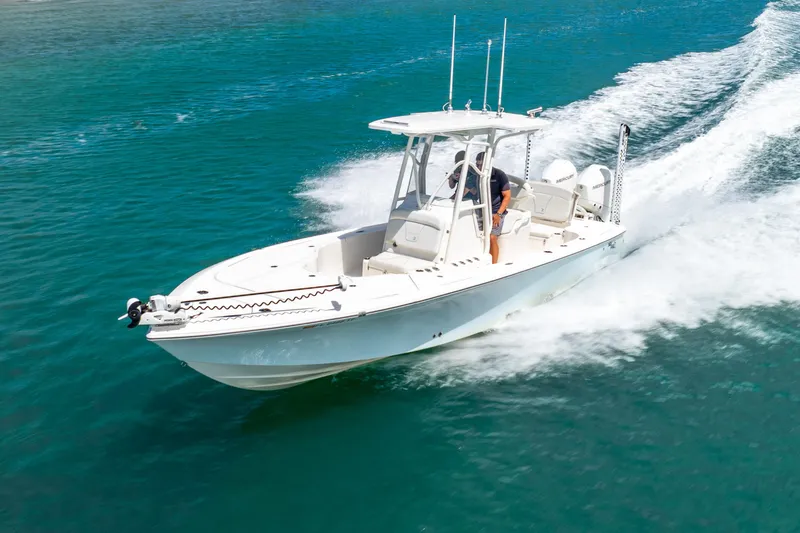  Yacht Photos Pics 2022 SeaVee 270Z boat cruising on clear blue water.