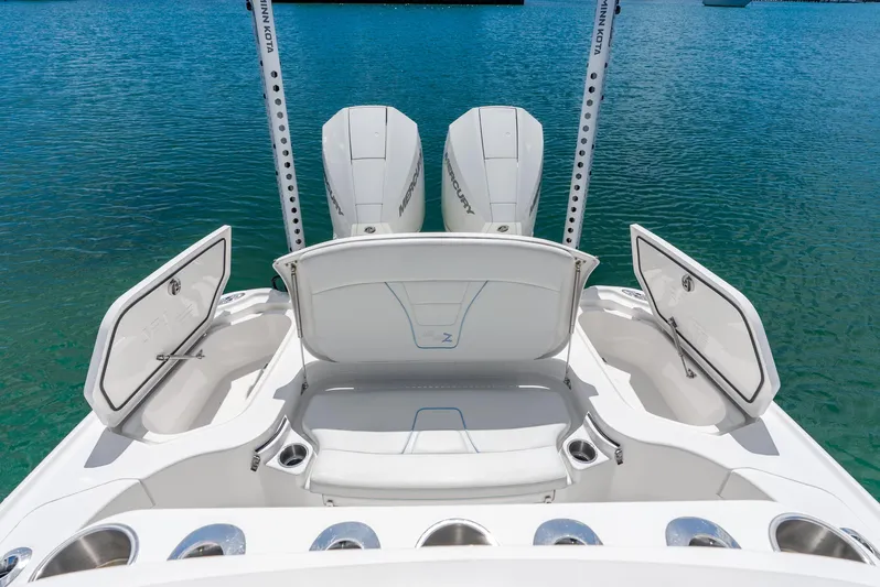  Yacht Photos Pics 2022 SeaVee 270Z boat with open storage compartments and twin Mercury engines.