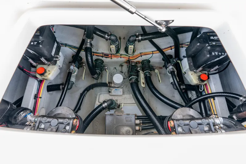  Yacht Photos Pics Engine compartment of 2022 SeaVee 270Z boat, showing wiring and mechanical components.