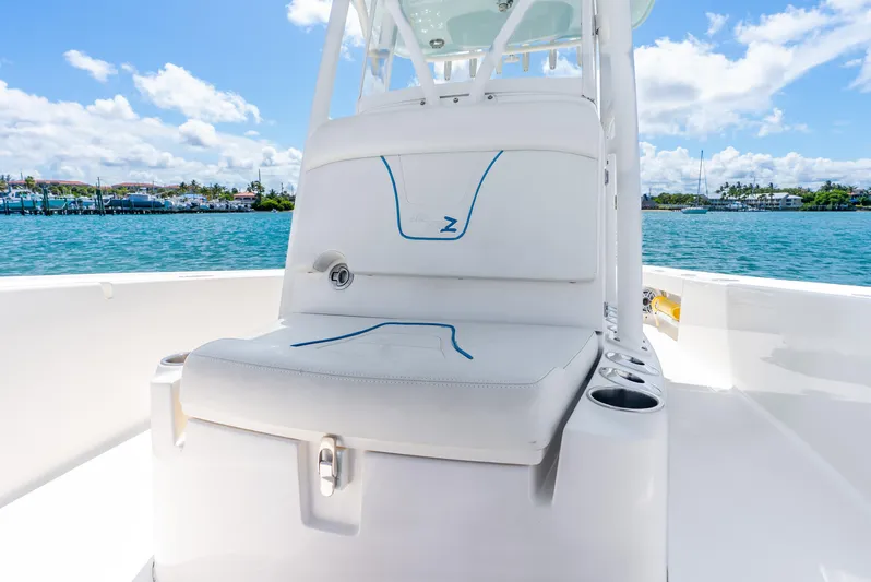  Yacht Photos Pics 2022 SeaVee 270Z boat interior with cushioned seating, cup holders, and ocean view.