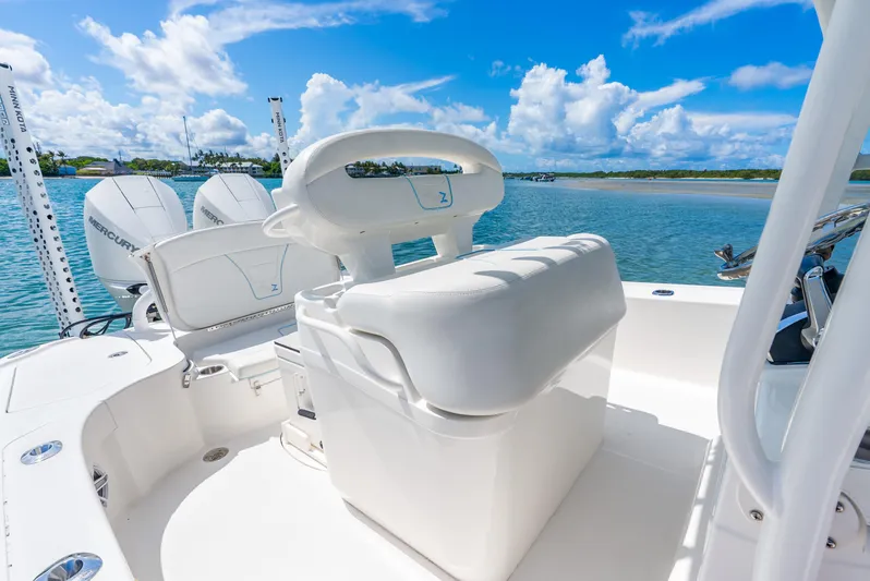  Yacht Photos Pics 2022 SeaVee 270Z boat interior with white seating, dual Mercury engines, and scenic water view.