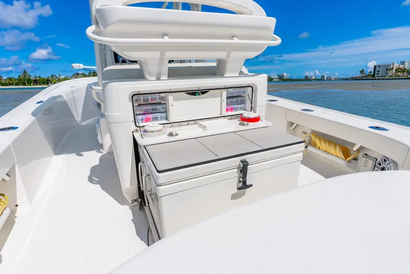  Yacht Photos Pics 2022 SeaVee 270Z boat interior with storage compartments, set against a scenic water backdrop.