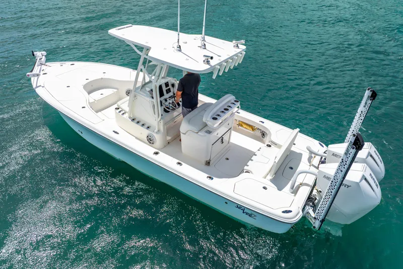 Yacht Photos Pics 2022 SeaVee 270Z boat on clear blue water, featuring dual Mercury engines.