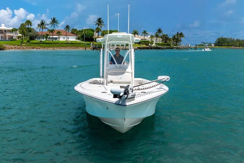  Yacht Photos Pics 2022 SeaVee 270Z boat on clear blue water with tropical background.