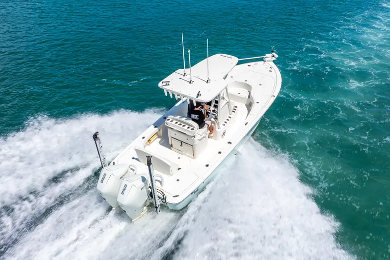  Yacht Photos Pics 2022 SeaVee 270Z boat cruising on clear blue water.