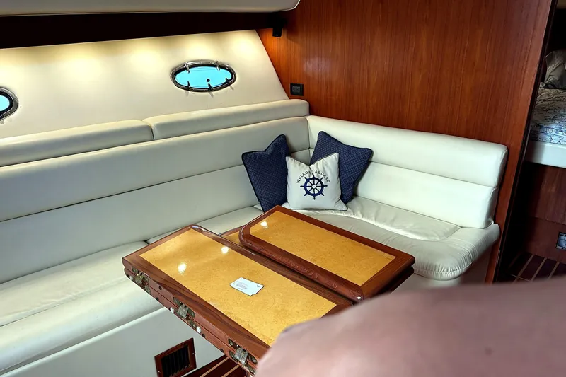 Mavi Yacht Photos Pics Interior of 2004 Tiara Yachts 4200 Open with cozy seating and nautical decor.