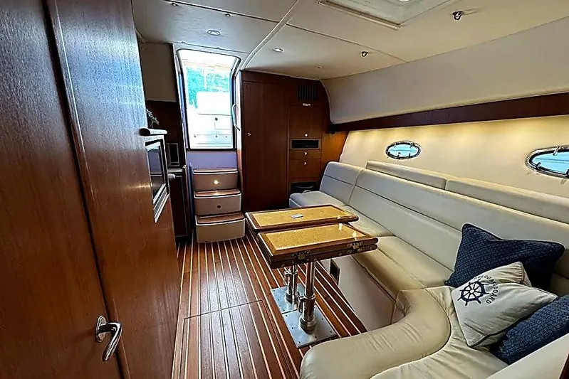 Mavi Yacht Photos Pics Interior of 2004 Tiara Yachts 4200 Open, featuring elegant wood and leather seating.
