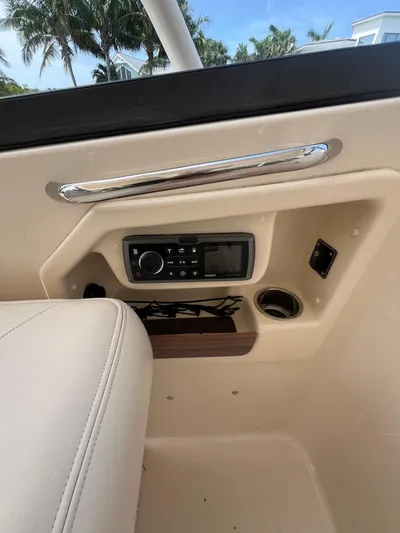  Yacht Photos Pics Interior of 2015 Grady-White Freedom 307 boat with control panel and cup holder.