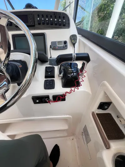  Yacht Photos Pics Control panel of a 2015 Grady-White Freedom 307 boat cockpit.