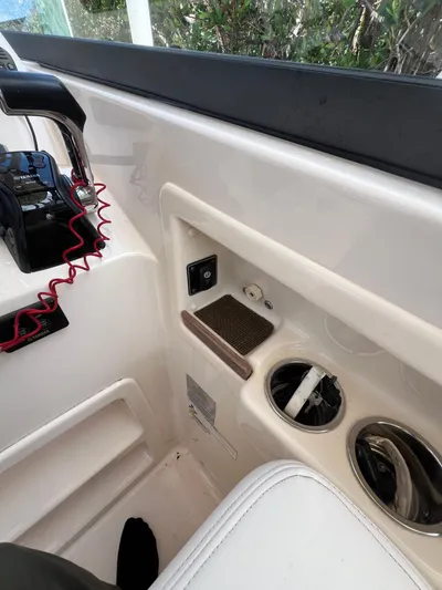  Yacht Photos Pics Interior of 2015 Grady-White Freedom 307 boat with control panel and cup holders.