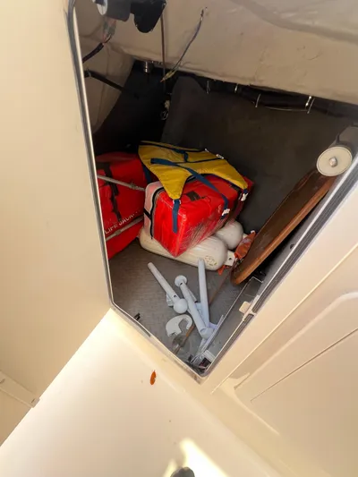  Yacht Photos Pics Storage compartment in 2015 Grady-White Freedom 307 boat with life jackets and equipment.