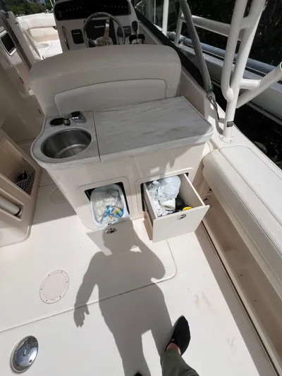  Yacht Photos Pics 2015 Grady-White Freedom 307 boat interior with sink and storage compartments.
