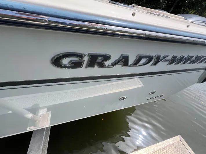  Yacht Photos Pics 2015 Grady-White Freedom 307 boat side view on water.