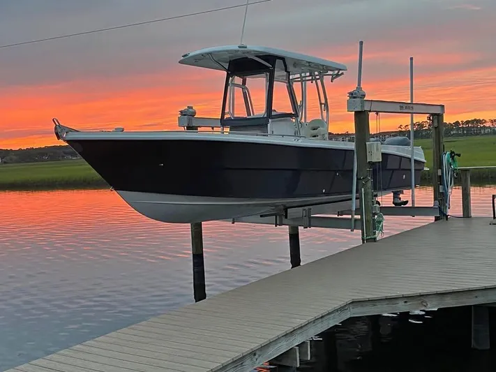  Yacht Photos Pics Custom Shark Fin R321 boat docked at sunset, 2025 model.