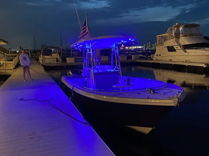  Yacht Photos Pics Custom Shark Fin R321 boat with blue lights docked at night, 2025 model.