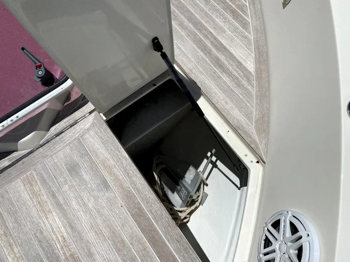  Yacht Photos Pics 2014 Azimut Atlantis Verve Outboard storage compartment with wooden deck and speaker.