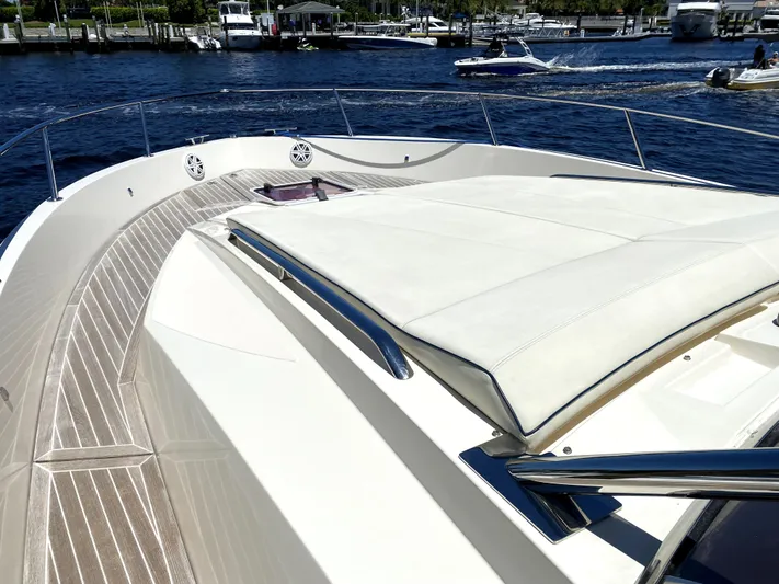  Yacht Photos Pics Azimut Atlantis Verve Outboard 2014 yacht deck with sunbed, docked by the water.