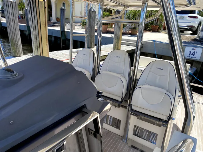  Yacht Photos Pics 2014 Azimut Atlantis Verve Outboard boat interior with white Verve seats at dock.