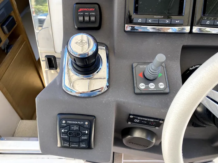  Yacht Photos Pics Close-up of 2014 Azimut Atlantis Verve Outboard control panel with joystick and buttons.