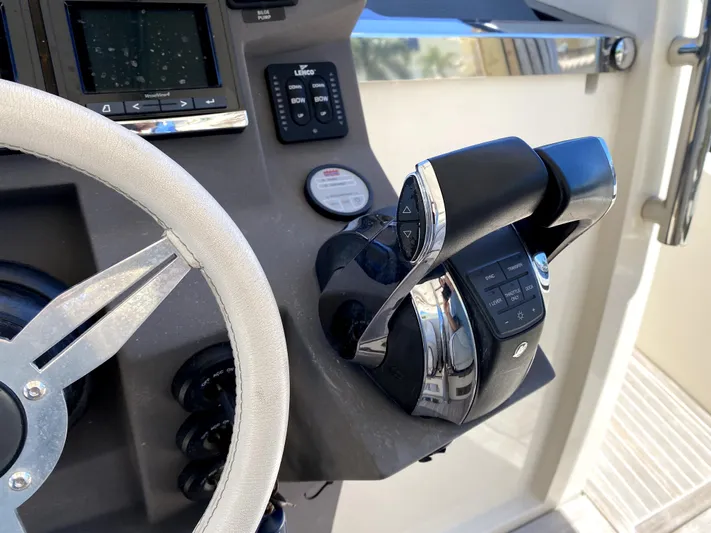  Yacht Photos Pics Azimut Atlantis Verve Outboard 2014 helm with steering wheel and throttle controls.