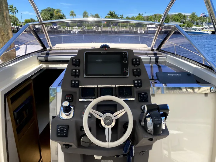  Yacht Photos Pics 2014 Azimut Atlantis Verve Outboard helm with modern controls and navigation system.