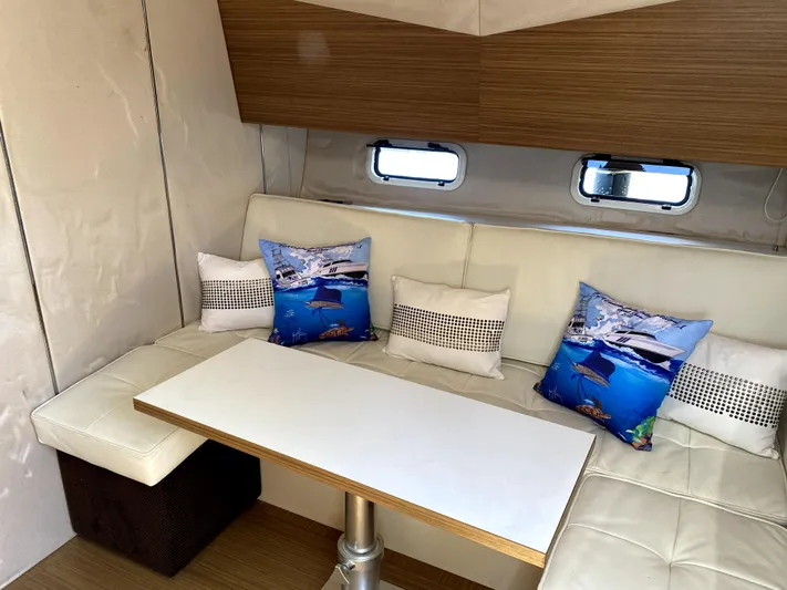  Yacht Photos Pics Azimut Atlantis Verve 2014 interior with white seating and decorative pillows.