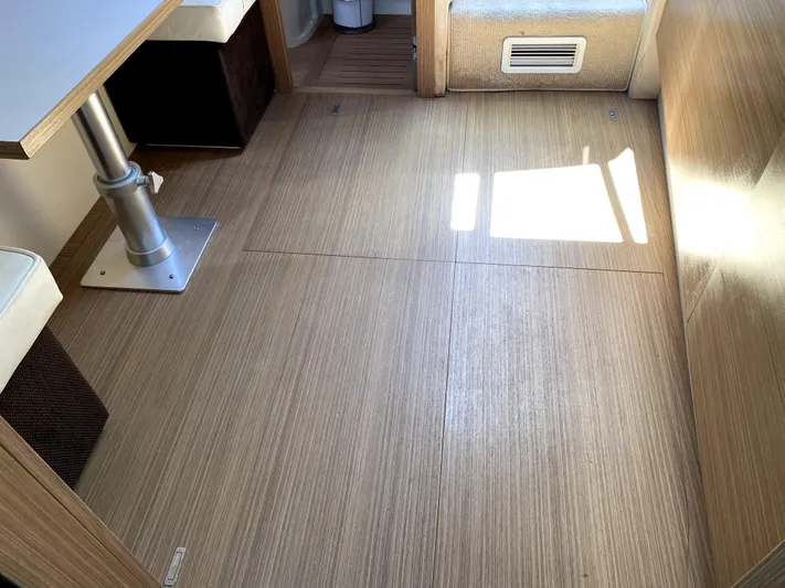  Yacht Photos Pics Interior of 2014 Azimut Atlantis Verve Outboard with wooden flooring and seating area.