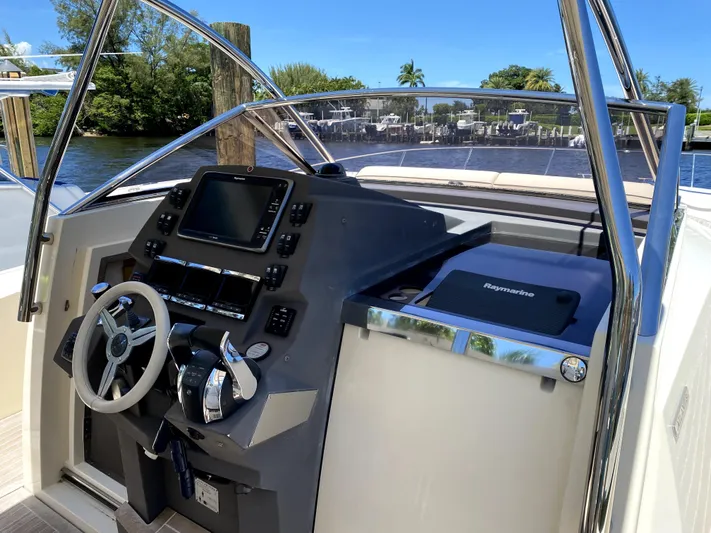  Yacht Photos Pics 2014 Azimut Atlantis Verve Outboard helm with modern controls and navigation system.