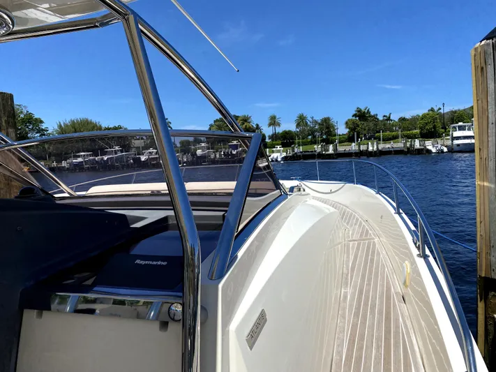  Yacht Photos Pics Azimut Atlantis Verve Outboard 2014 yacht docked by a scenic waterfront.