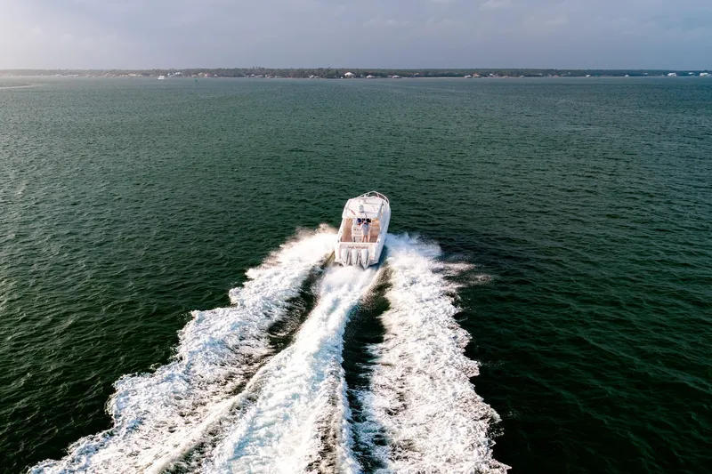  Yacht Photos Pics Aerial view of 2020 Intrepid 407 Cuddy cruising on open water.