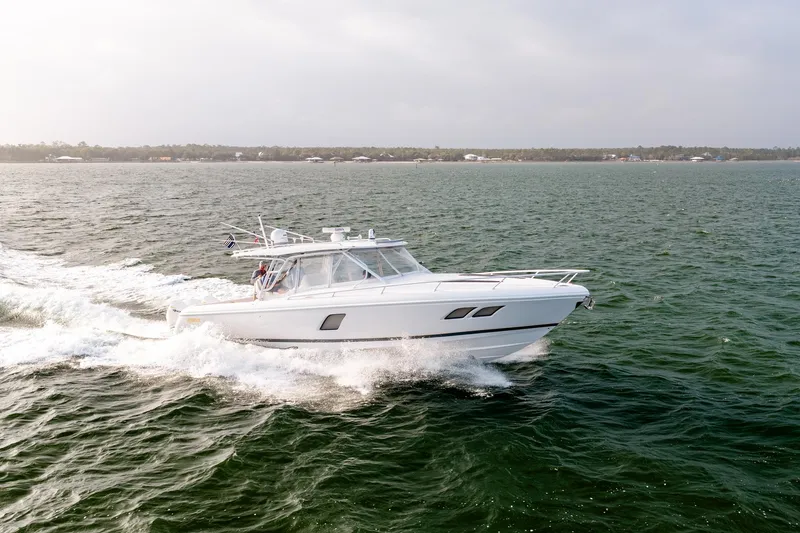  Yacht Photos Pics 2020 Intrepid 407 Cuddy cruising on open water, showcasing sleek design and performance.