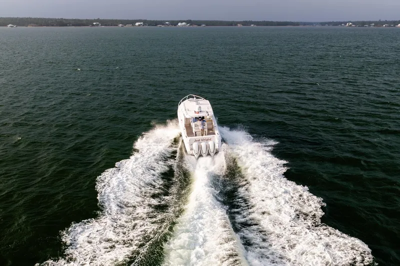 Yacht Photos Pics Aerial view of 2020 Intrepid 407 Cuddy boat cruising on open water.